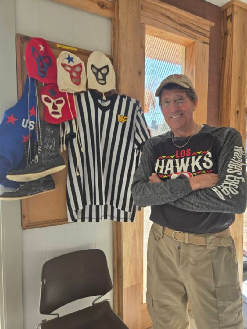 Jimmy with his WWF ref shirt and lucha masks